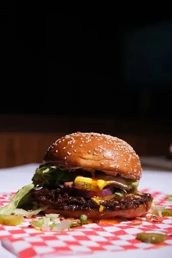 Smash burger with cheese, red onion and pickles